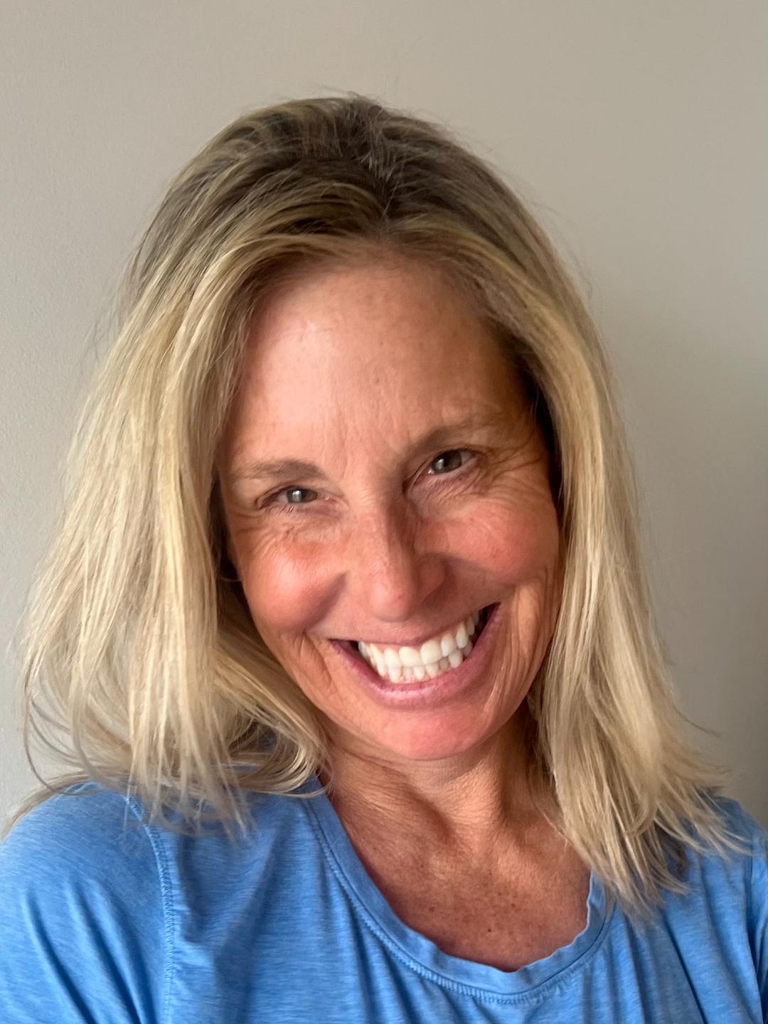 Massage therapist in a blue shirt