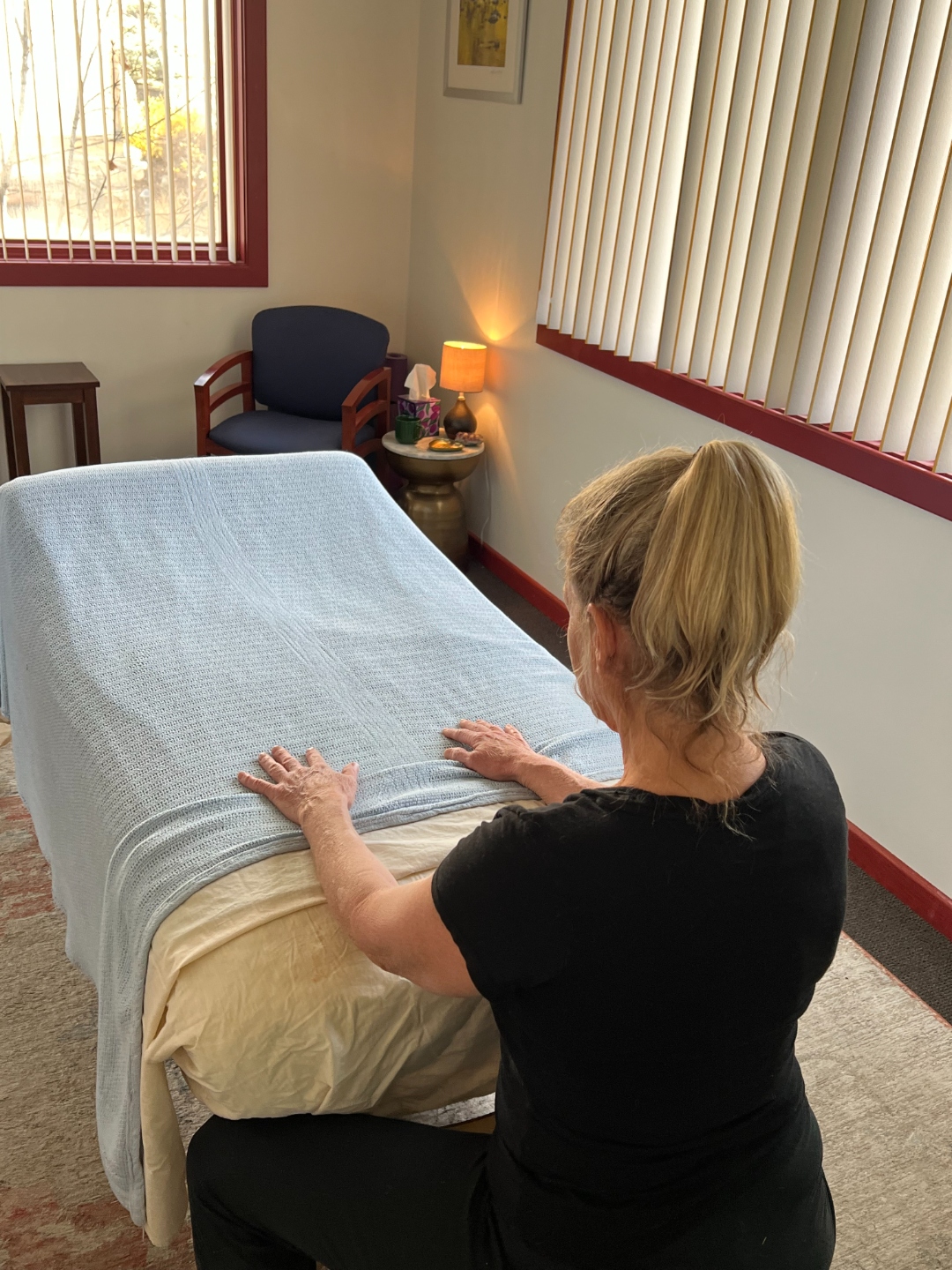 Massage room with a prepared treatment table